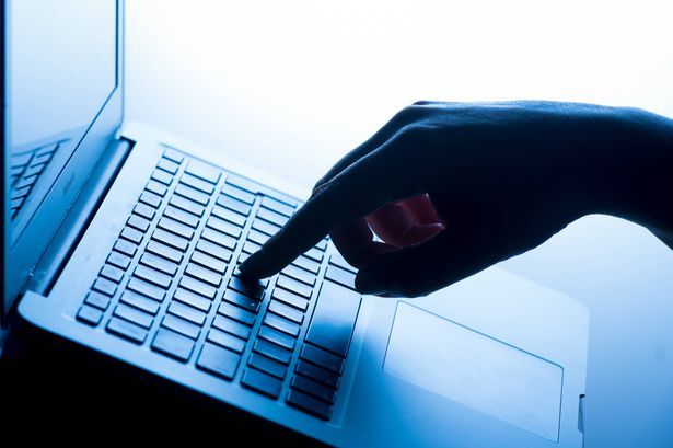 imported-0_Online-fraud-File-photo-dated-040317-of-a-womans-hand-pressing-a-key-of-a-laptop-keyboard-Photo-Dominic-LipinskiPA-Wire.jpg