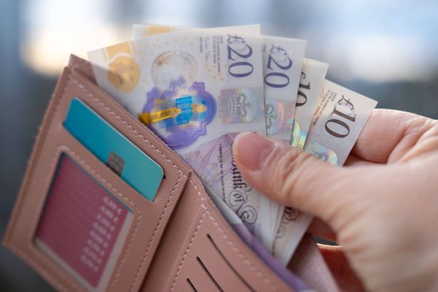 imported-0_wallet-with-British-GBP-banknotes-cash-in-female-hands-counting-uk-pounds-bills-paper-money-Money-Management-Accuracy.jpg