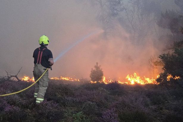 imported-0_Undated-handout-photo-issued-by-Suffolk-County-Council-of-firefighters-at-the-scene-of-a-wildfire-at-Dunwich-Heath-near.jpg