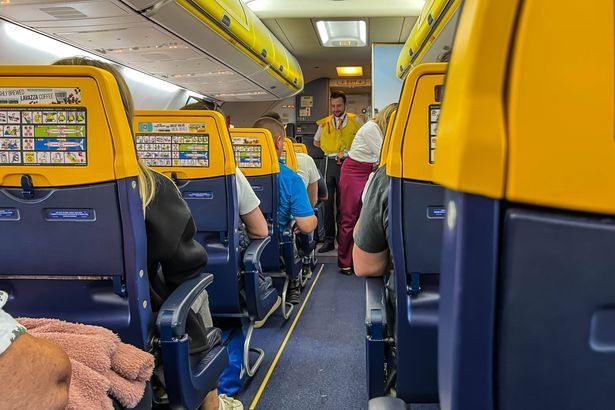 imported-0_Safety-training-on-a-Ryanair-Boeing-737-800-based-on-instructions-on-the-planes-seat-and-instruction-by-a-steward.jpg