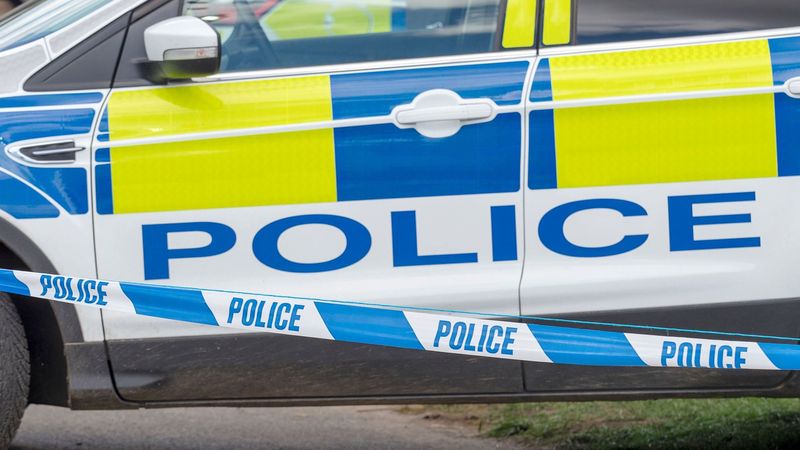 imported-skynews-police-car-police-tape_6916669.jpg