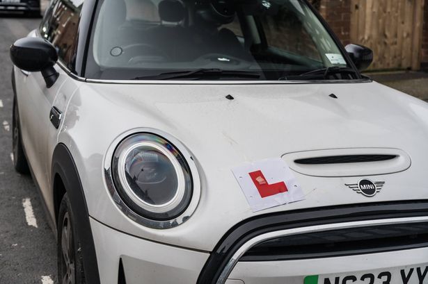 imported-0_A-close-up-of-a-white-Mini-Cooper-with-a-Learner-L-Plate.jpg