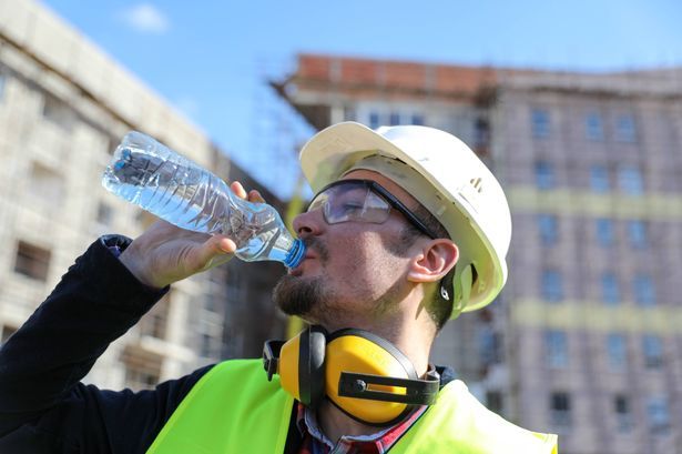 imported-0_boss-at-construction-site-with-bottle-of-water-close-up.jpg