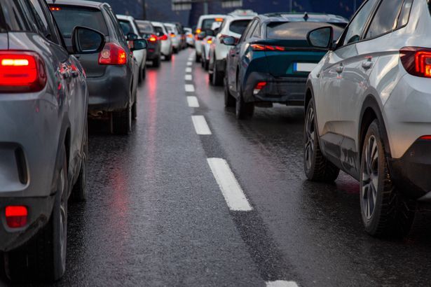 imported-2_Traffic-jam-with-a-row-of-cars-on-a-highway-during-rush-hour-in-the-evening-after-work-red-brake-lights-of-stopped-car.jpg