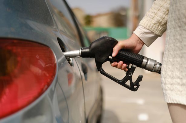 imported-0_unrecognizable-woman-using-gas-pump-to-add-fuel-to-her-car-during-energy-crisis.jpg