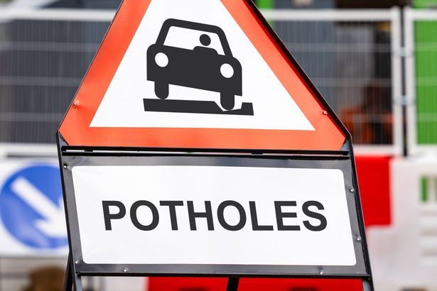 imported-0_Pothole-hazard-road-work-warning-sign.jpg