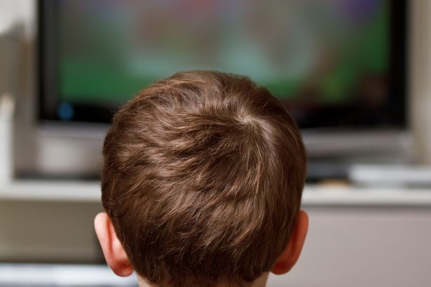 imported-1_Rear-view-of-young-boy-watching-television.jpg