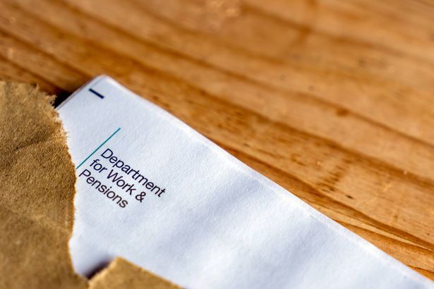imported-0_Opened-Envelope-with-State-Pension-Increase-Notification-on-Wooden-Surface.jpg