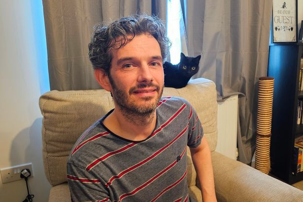 imported-0_Christian-Evans-with-cat-Magic.jpg