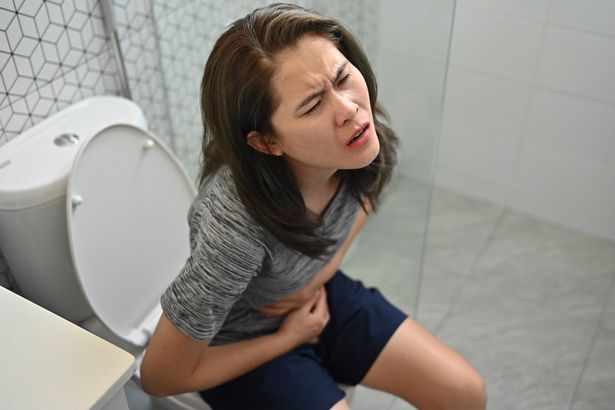 imported-0_Asian-woman-having-stomach-ache-while-sitting-on-toilet-A-stomach-ache-is-cramps-or-a-dull-ache-in-the-tummy-abdomen.jpg
