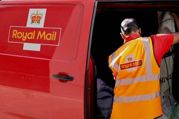 imported-0_A-Royal-Mail-worker-sorting-mail-in-a-postal-van.jpg