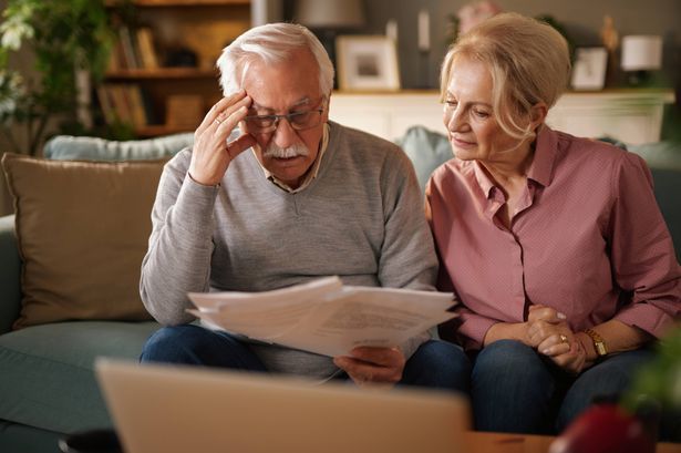 imported-0_Worried-senior-couple-reading-documents-at-home-on-sofa.jpg