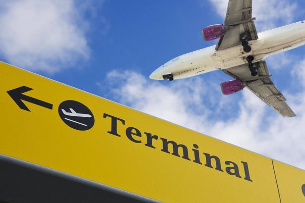imported-0_Plane-flying-over-terminal-sign.jpg